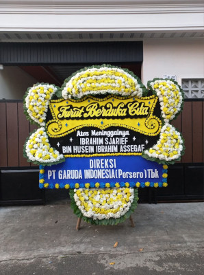 Papan Bunga Duka di Tuyau