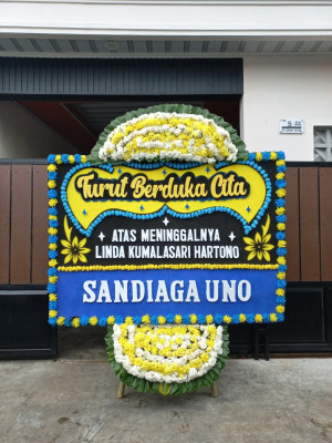 Papan Bunga Duka di Tuyau